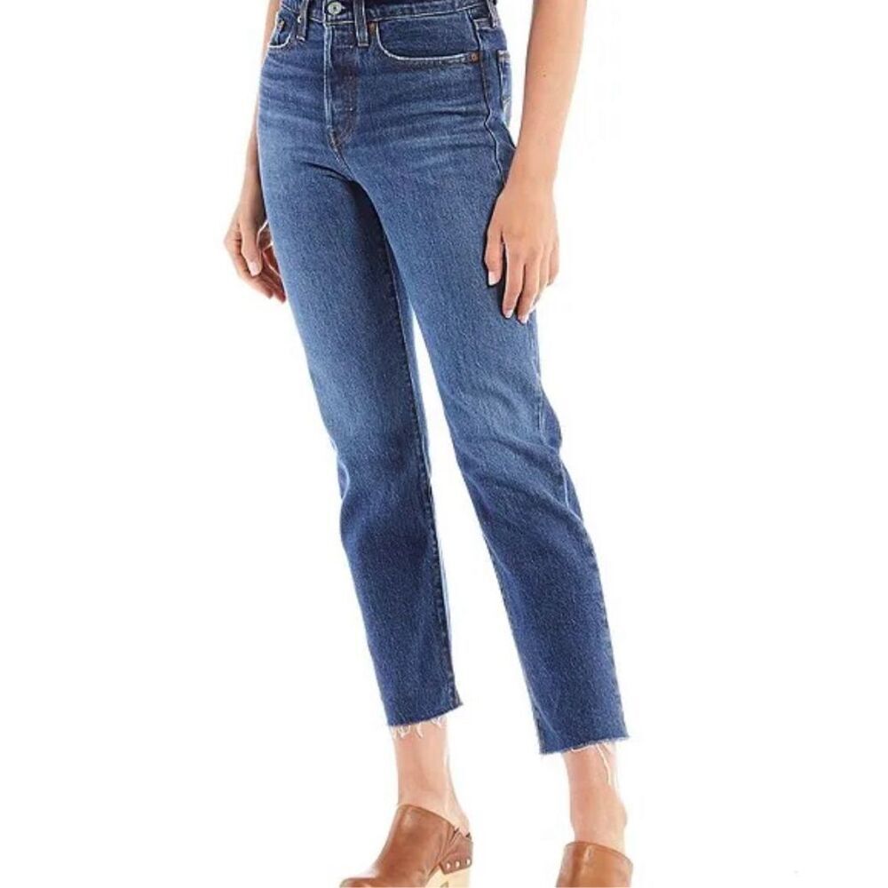Levi’s 26” Wedgie Straight high waisted button fly raw hem jeans.